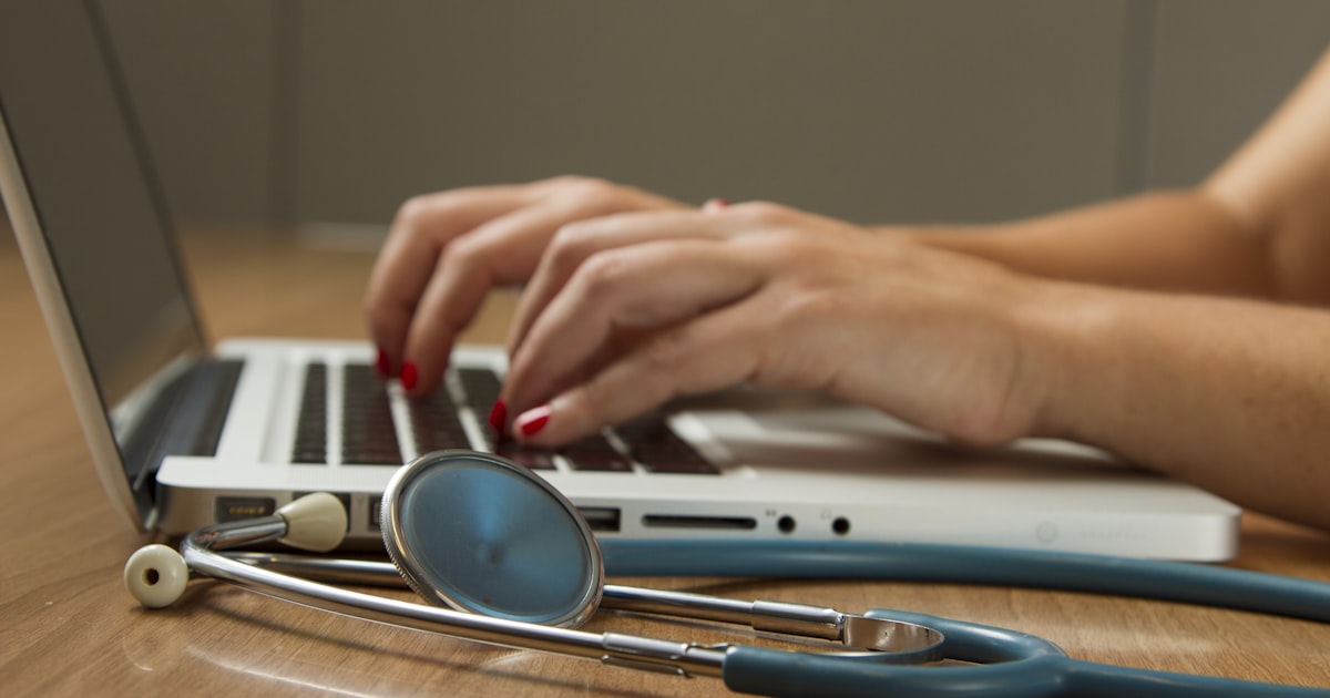 Person comparing health insurance plan options on computer