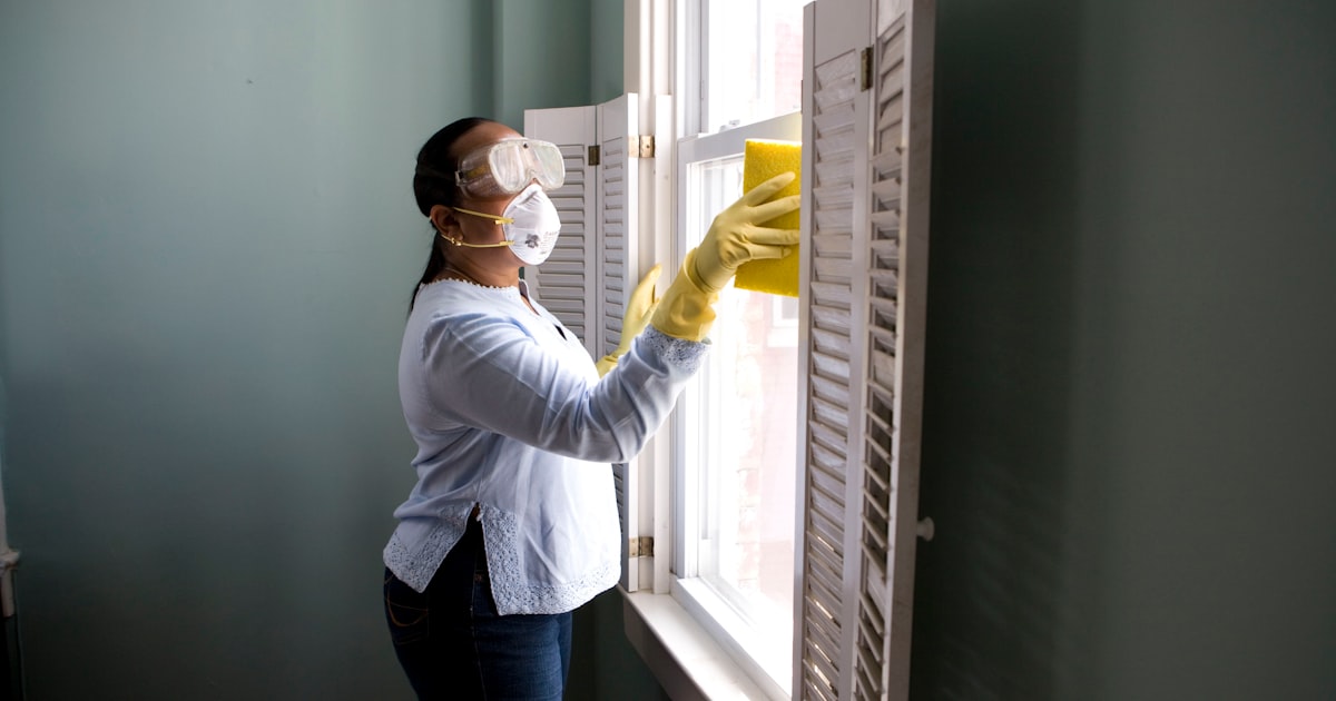 Home appliances and house representing home warranty vs homeowners insurance